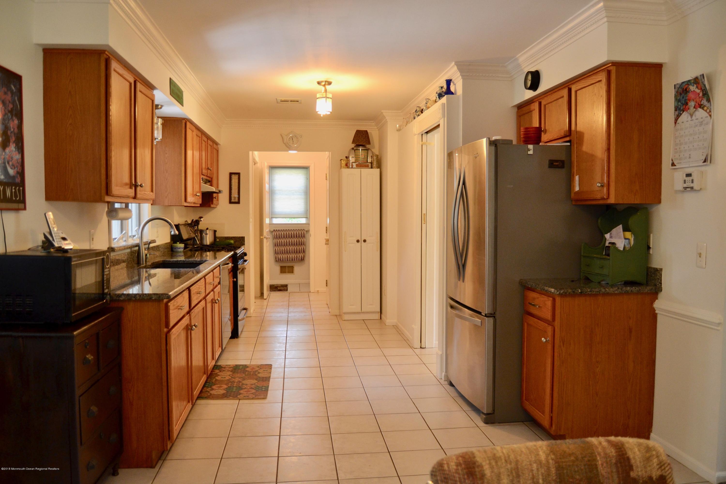 3087 Ridgeway Boulevard Manchester Township, NJ 08759 - Photo 16 of 30 a kitchen with stainless steel appliances a refrigerator and a sink