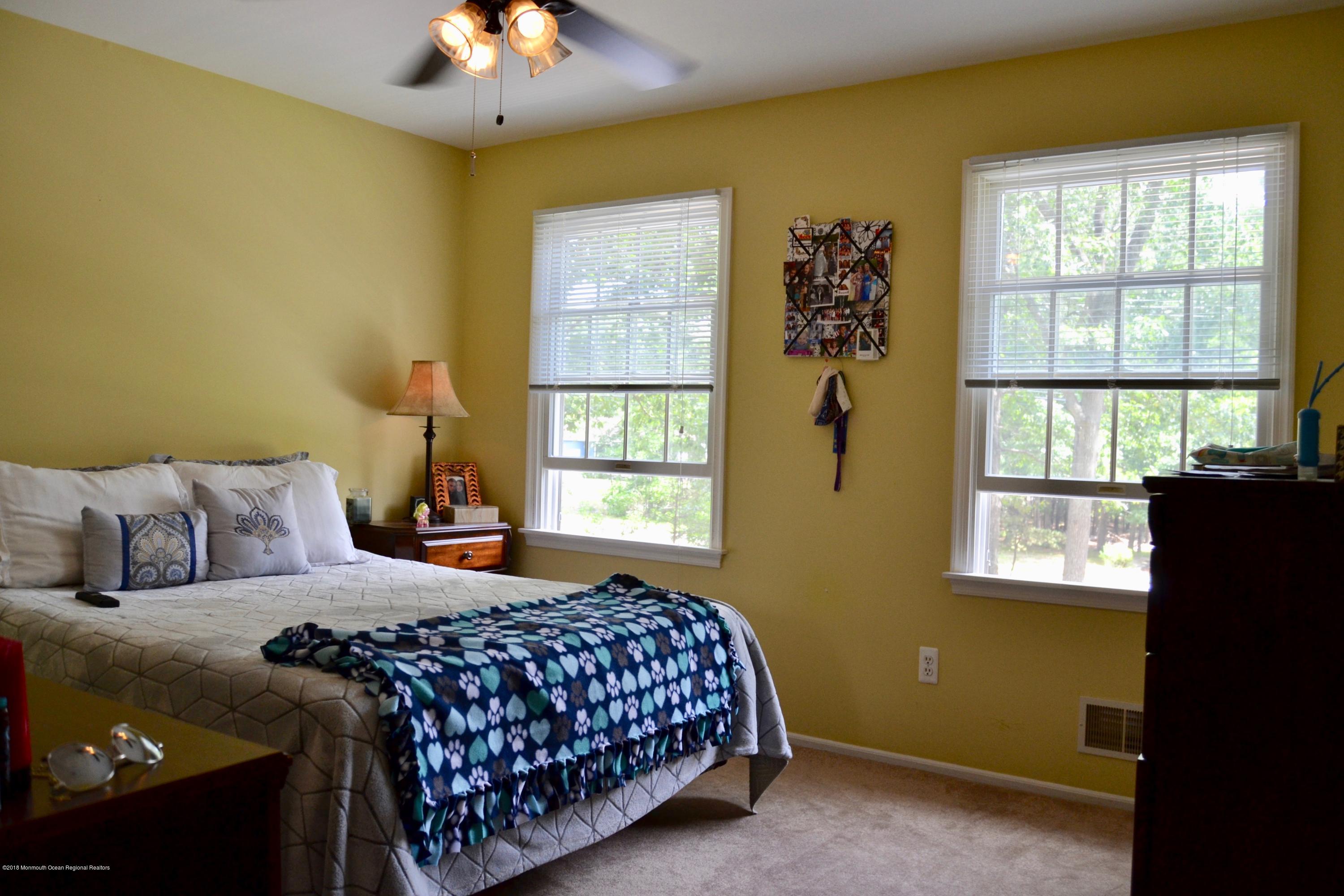 3087 Ridgeway Boulevard Manchester Township, NJ 08759 - Photo 23 of 30 a bedroom with a bed and a window