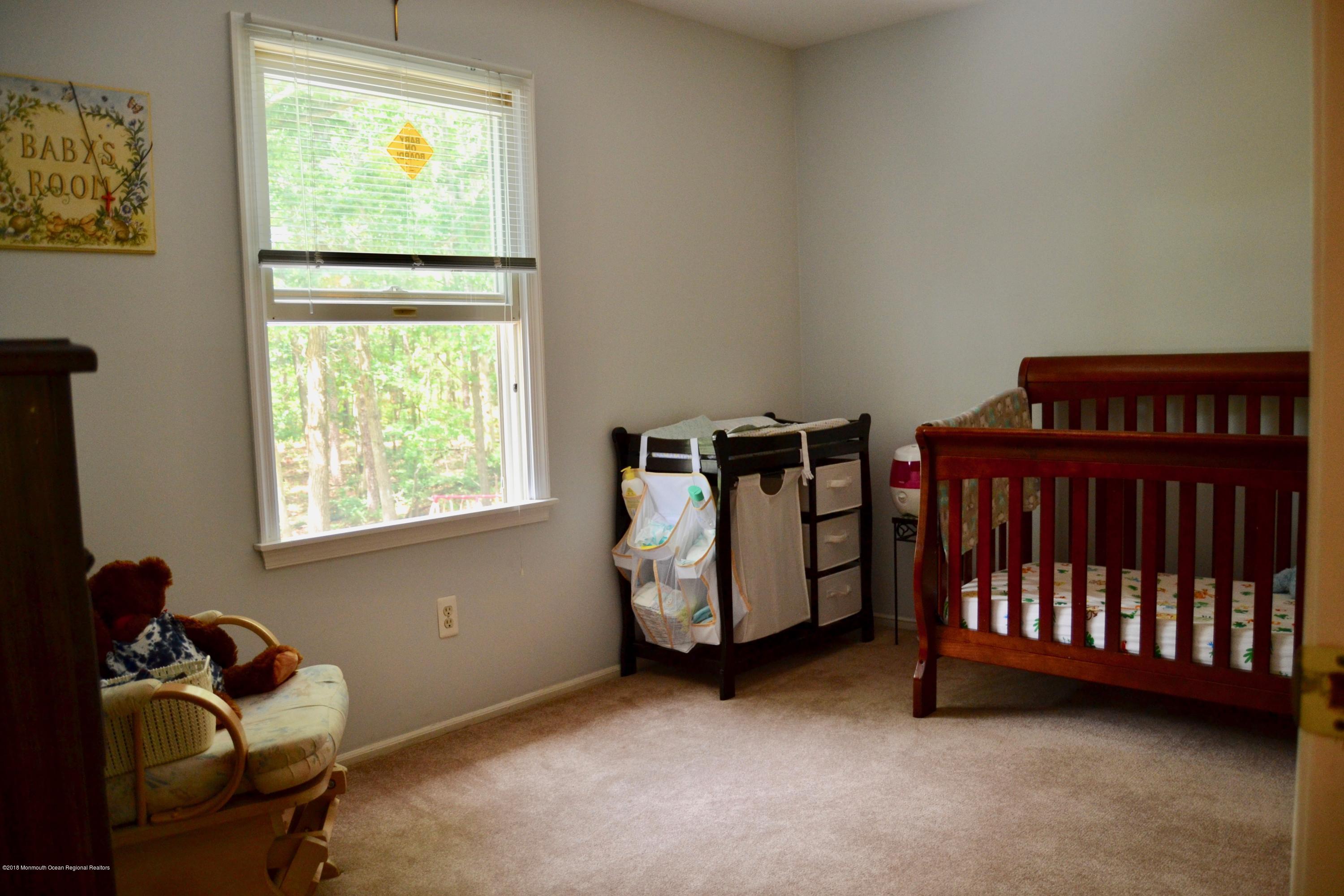 3087 Ridgeway Boulevard Manchester Township, NJ 08759 - Photo 24 of 30 a livingroom with furniture and a window
