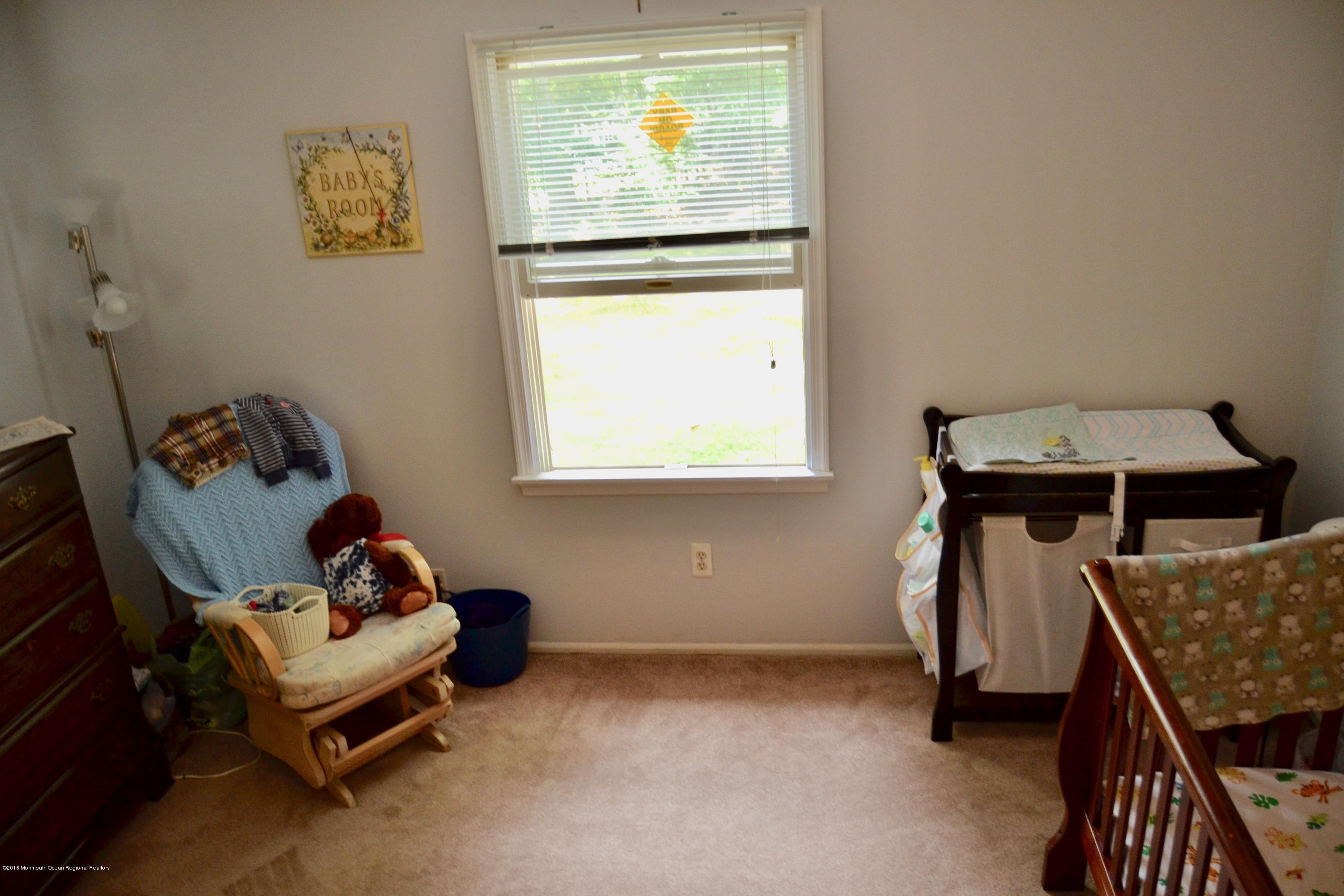 3087 Ridgeway Boulevard Manchester Township, NJ 08759 - Photo 25 of 30 a living room with furniture and a window
