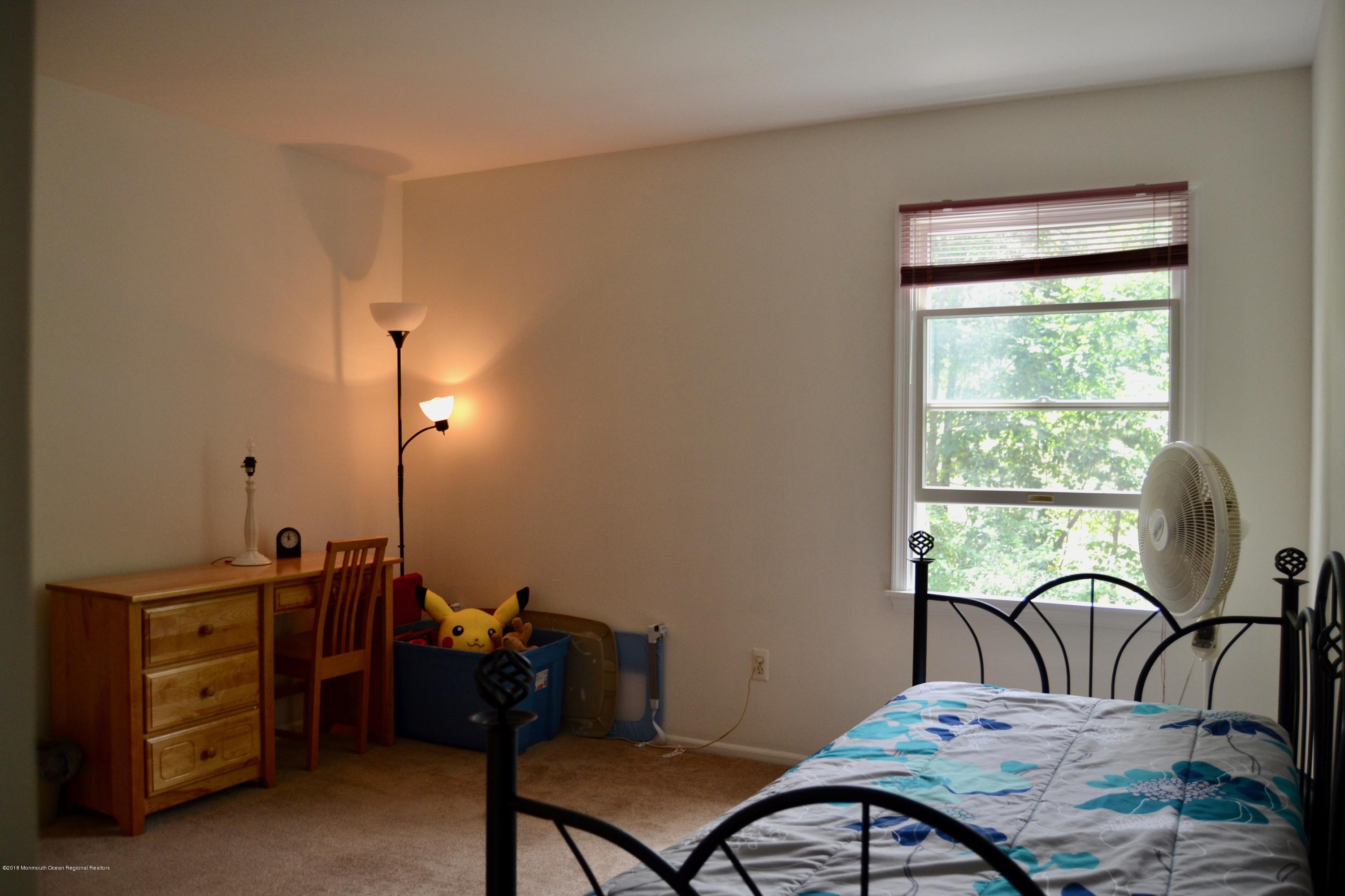 3087 Ridgeway Boulevard Manchester Township, NJ 08759 - Photo 26 of 30 a living room with furniture and a window