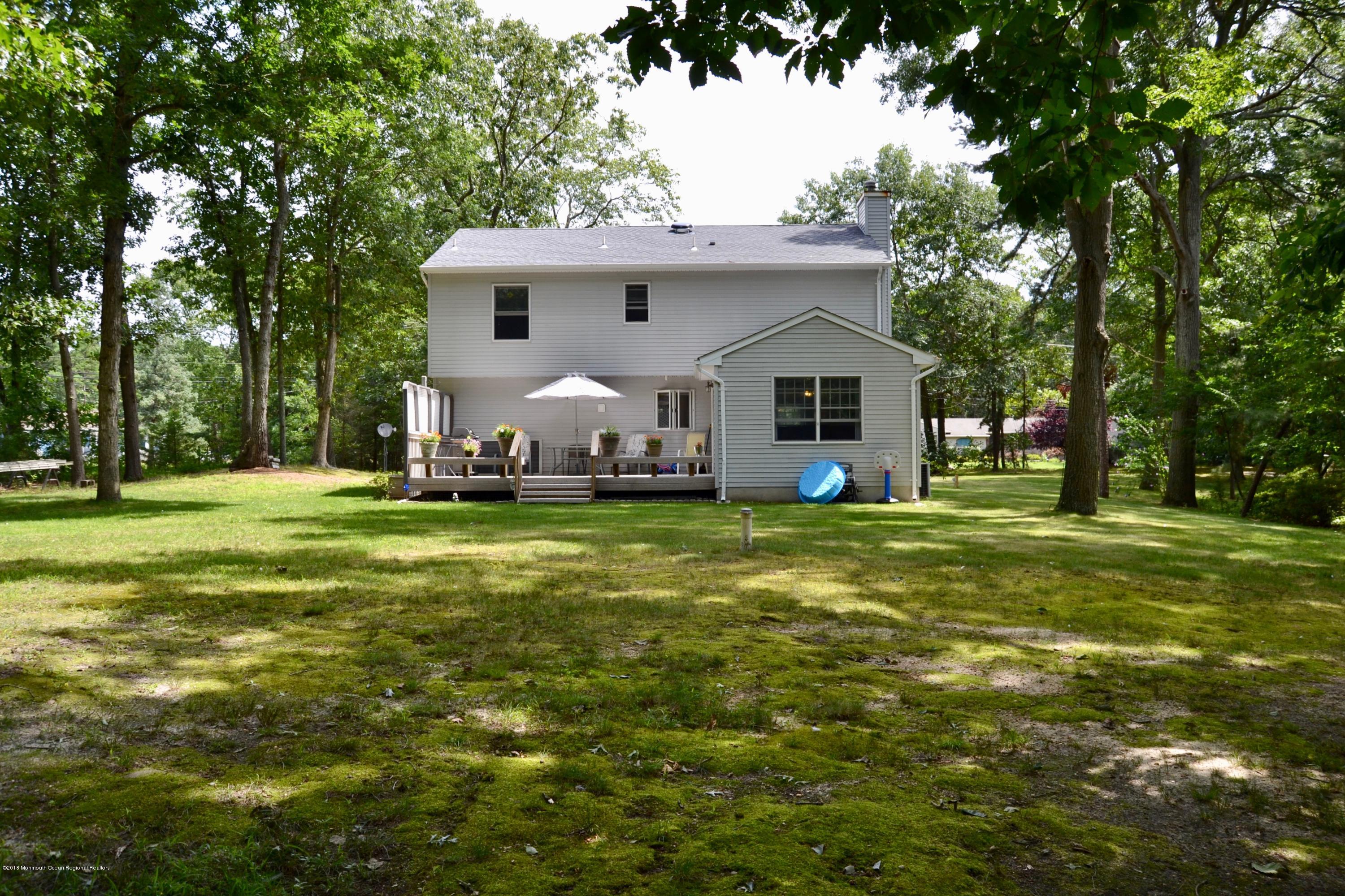 3087 Ridgeway Boulevard Manchester Township, NJ 08759 - Photo 5 of 30 a front view of a house with garden