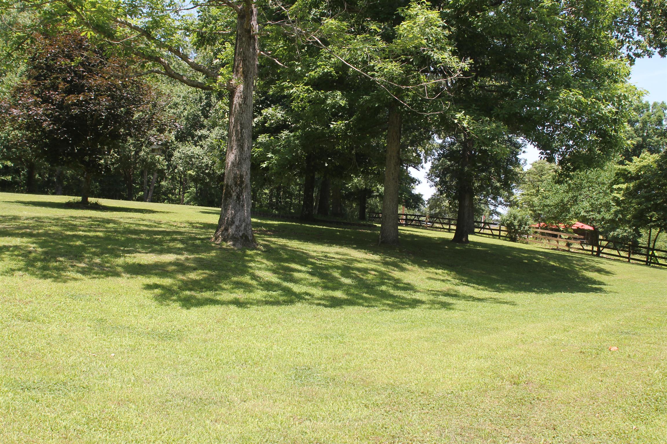 485 Metal Ford Road Hohenwald, TN 38462 - Photo 3 of 20 Horse Barn w/2 Stalls and Tack Rm for 2 more Stalls Wood Fence