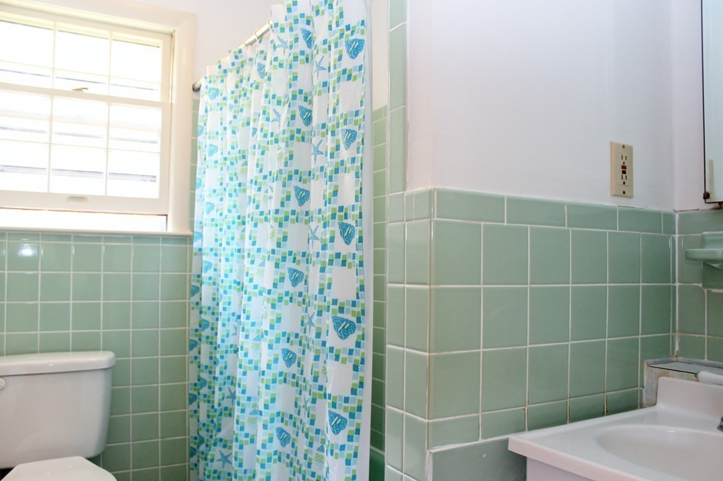 49 Rockland Street Hingham, MA 02043 - Photo 12 of 28 a bathroom with a toilet and shower