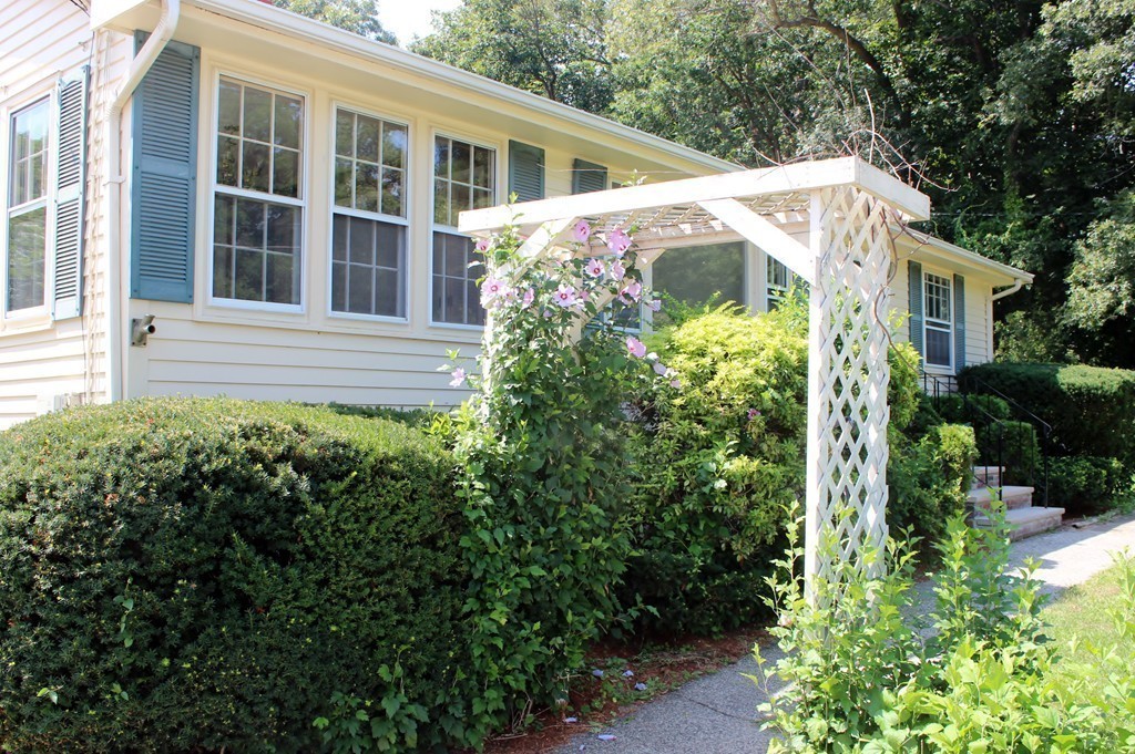 49 Rockland Street Hingham, MA 02043 - Photo 16 of 28 a front view of a house with a yard