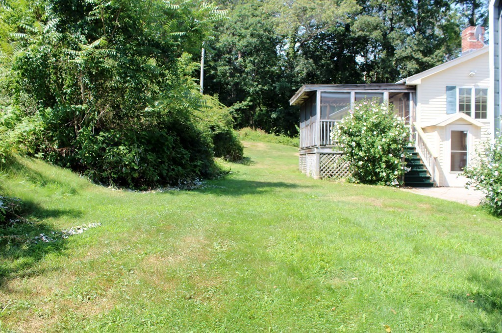 49 Rockland Street Hingham, MA 02043 - Photo 18 of 28 a view of a back yard of the house