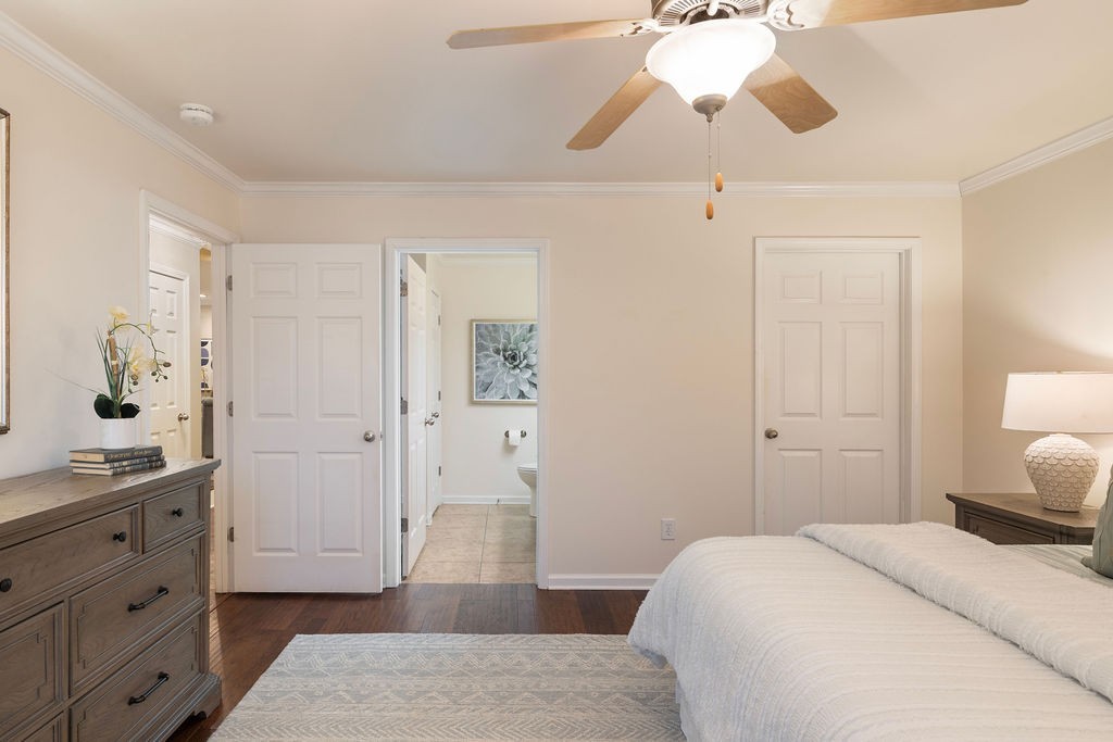 2211 Bridgeway Street Murfreesboro, TN 37128 - Photo 11 of 32 a bedroom with a bed and a chandelier