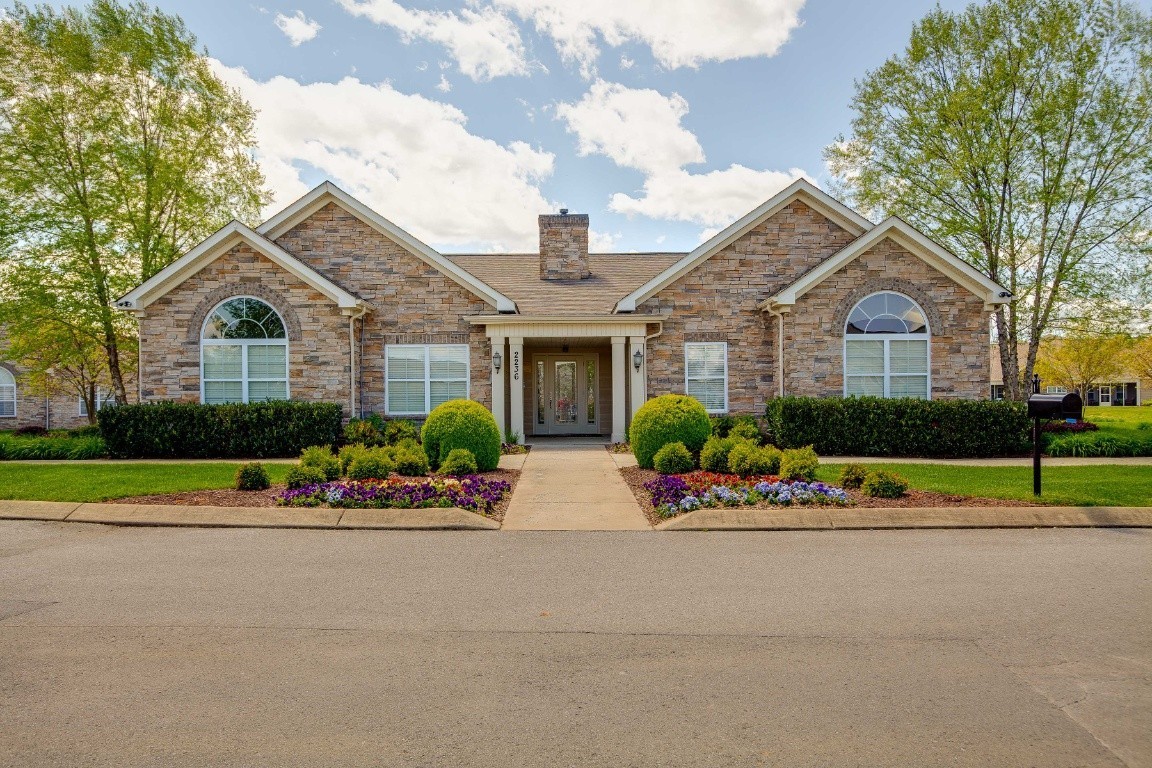 2211 Bridgeway Street Murfreesboro, TN 37128 - Photo 14 of 32 a front view of a house with a garden and plants