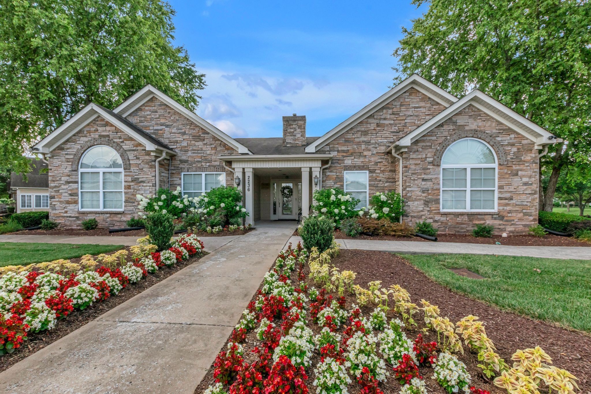 2211 Bridgeway Street Murfreesboro, TN 37128 - Photo 2 of 32 a front view of a house with a yard