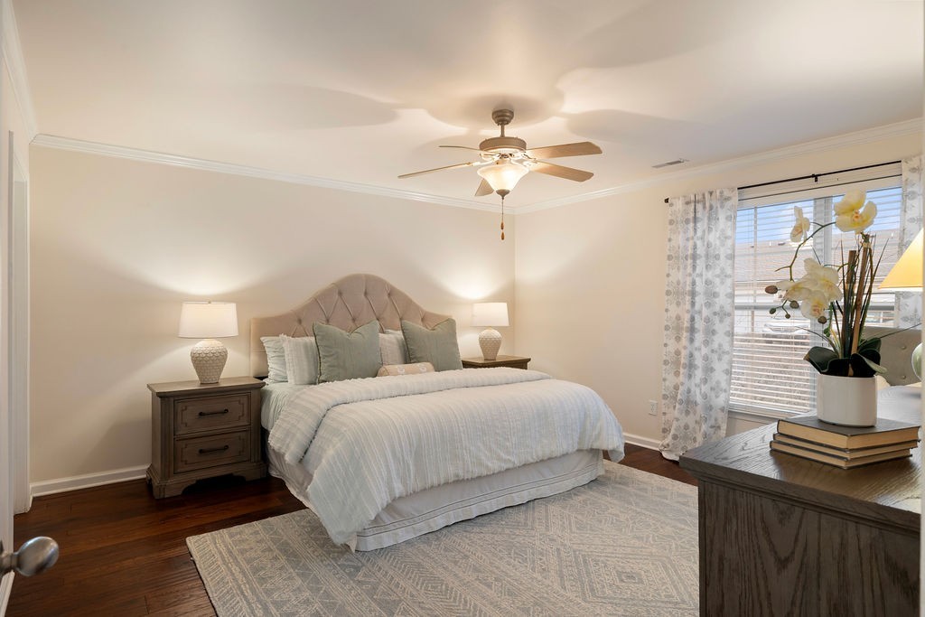 2211 Bridgeway Street Murfreesboro, TN 37128 - Photo 10 of 32 a bedroom with a bed and a chandelier