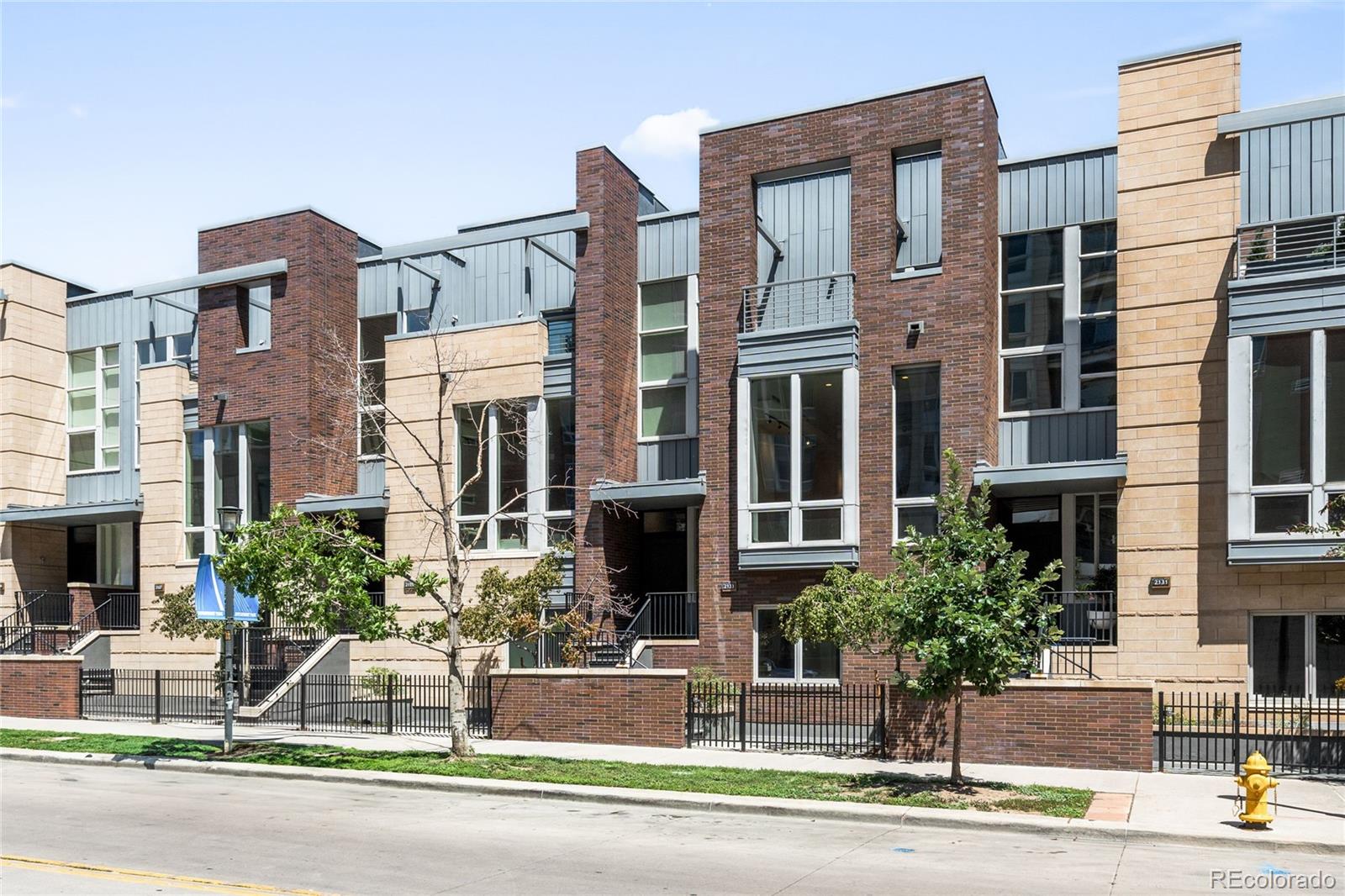 2133 18th Street Denver, CO 80202 - Photo 2 of 46 a front view of a building with street view