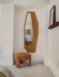 a living room with a couch and dresser
