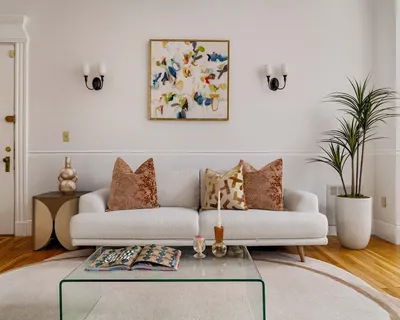 a living room with furniture and potted plant