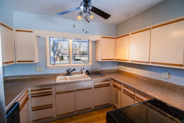 a kitchen that has a sink and a stove