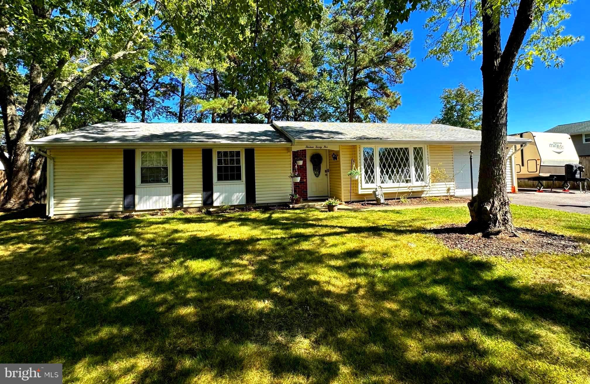 a front view of a house with yard
