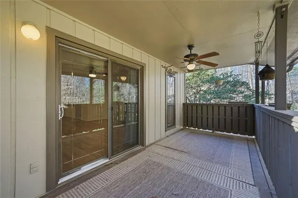 a view of porch with wooden floor