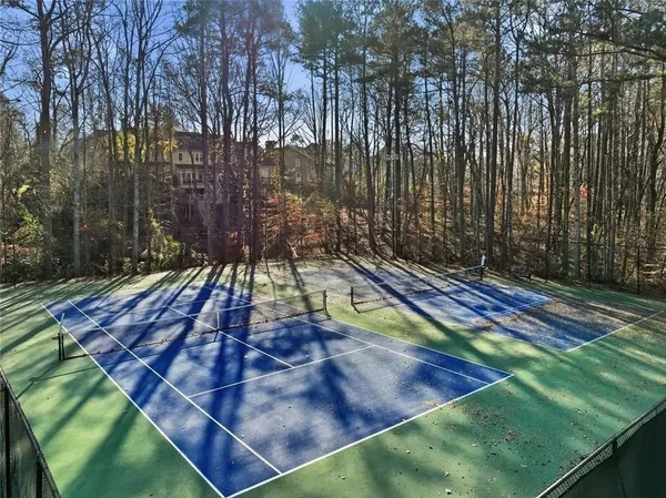 a view of backyard with swimming pool and outdoor seating