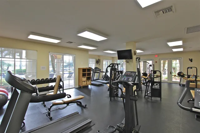 a living room with lots of furniture and wooden floor