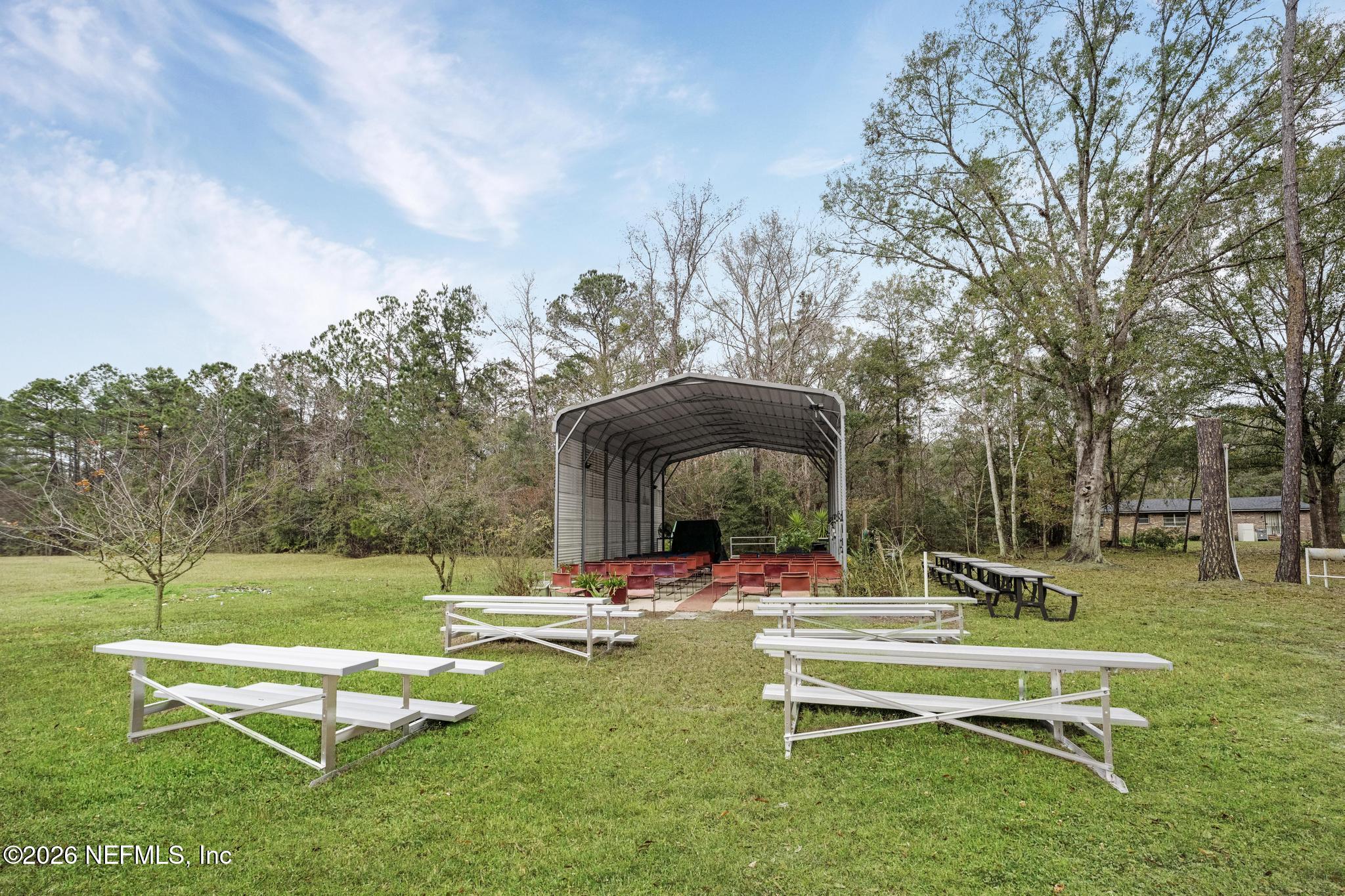 6647 Jammes Road Jacksonville, FL 32244 - Photo 11 of 17 a swimming pool with outdoor seating and yard