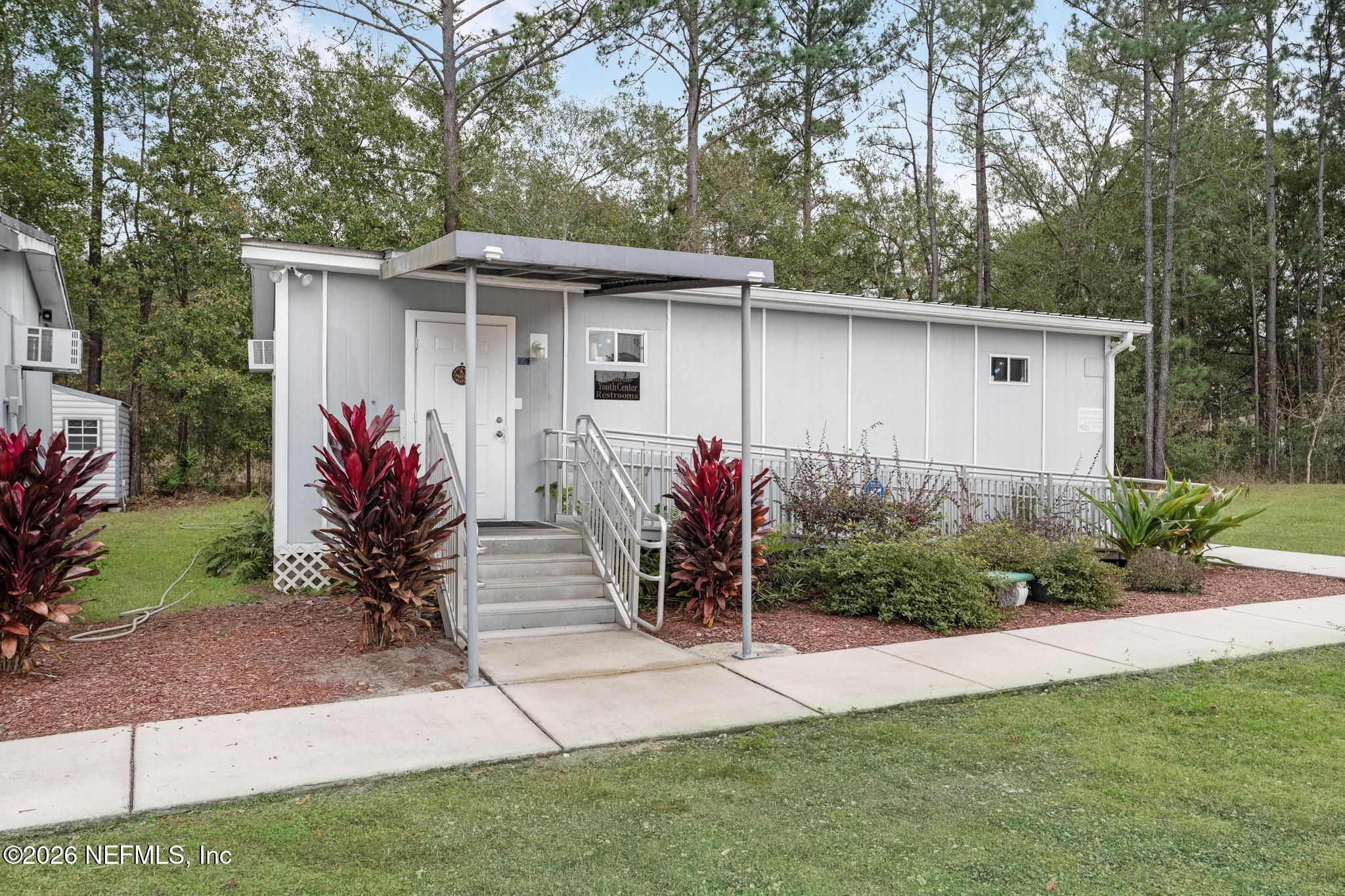 6647 Jammes Road Jacksonville, FL 32244 - Photo 13 of 17 a front view of house with yard and trees