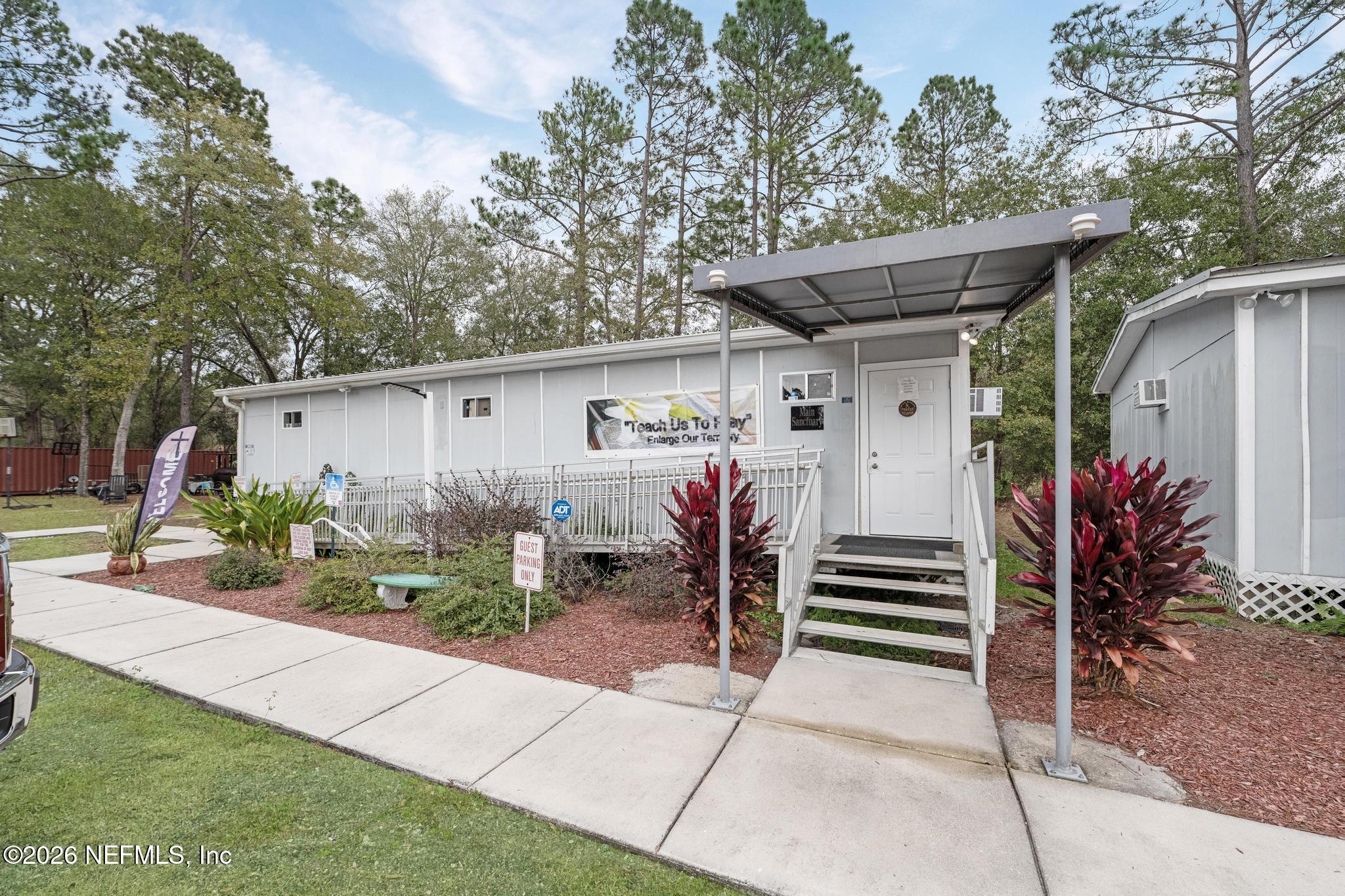 6647 Jammes Road Jacksonville, FL 32244 - Photo 9 of 17 a view of a house with backyard and sitting area