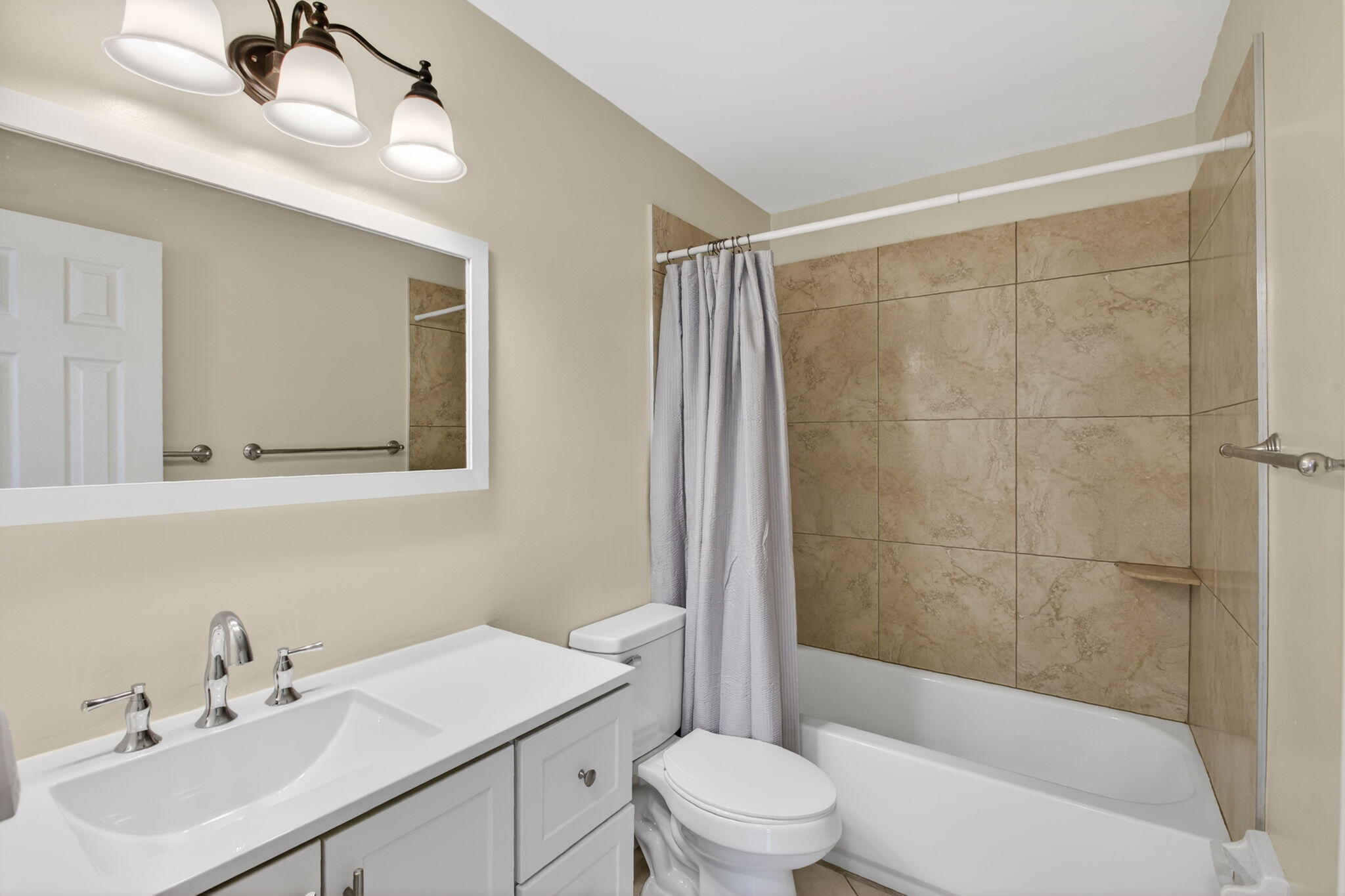8695 Southeast Hobe Ridge Avenue Hobe Sound, FL 33455 - Photo 13 of 29 a bathroom with a sink mirror toilet and bathtub