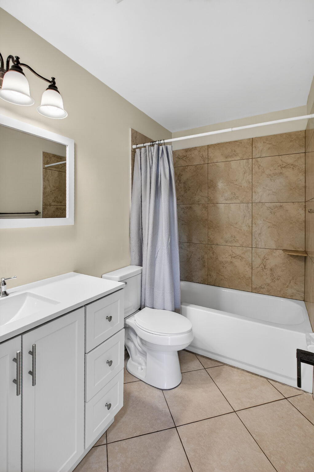 8695 Southeast Hobe Ridge Avenue Hobe Sound, FL 33455 - Photo 14 of 29 a bathroom with a sink toilet and shower