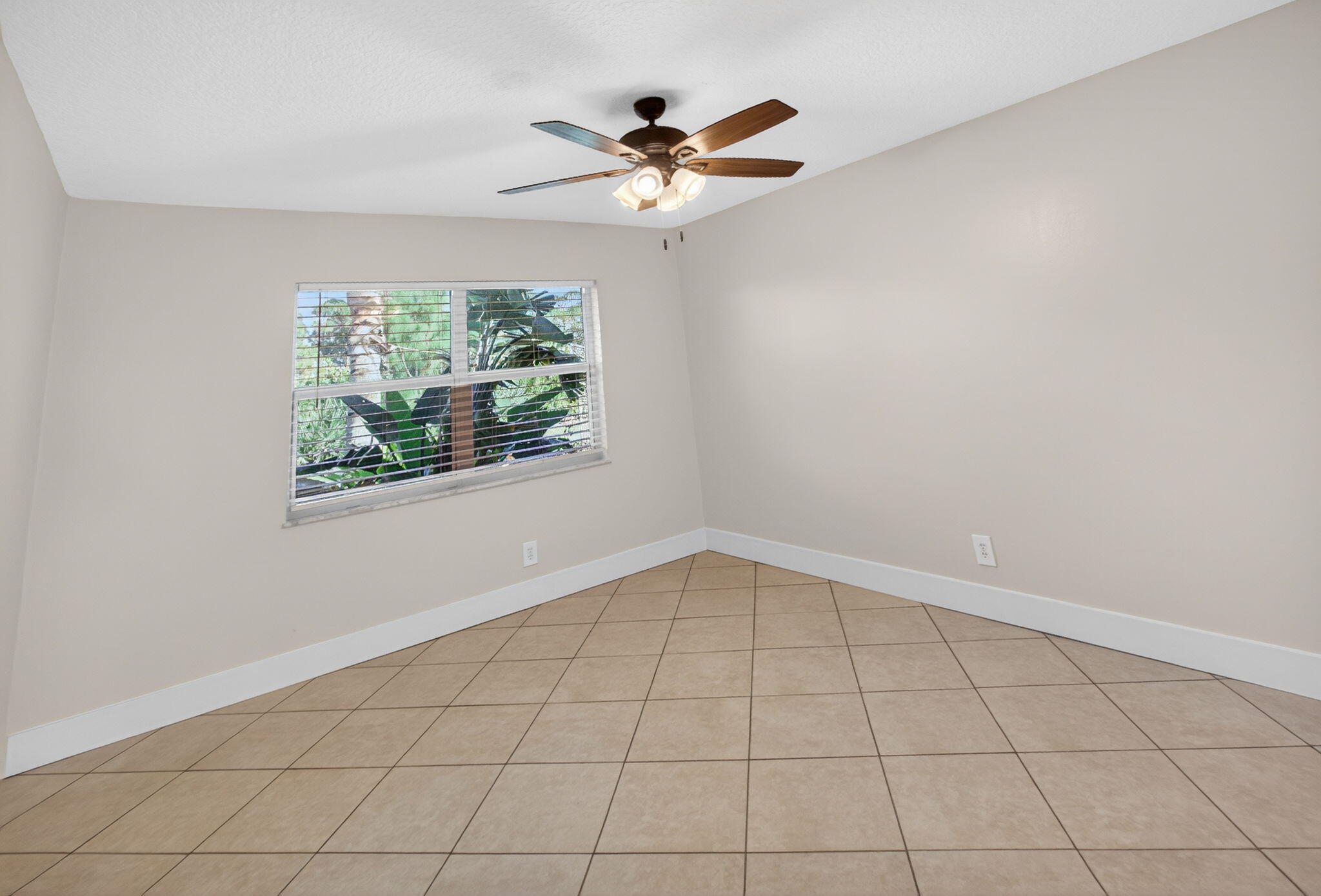 8695 Southeast Hobe Ridge Avenue Hobe Sound, FL 33455 - Photo 16 of 29 a view of an empty room with a window