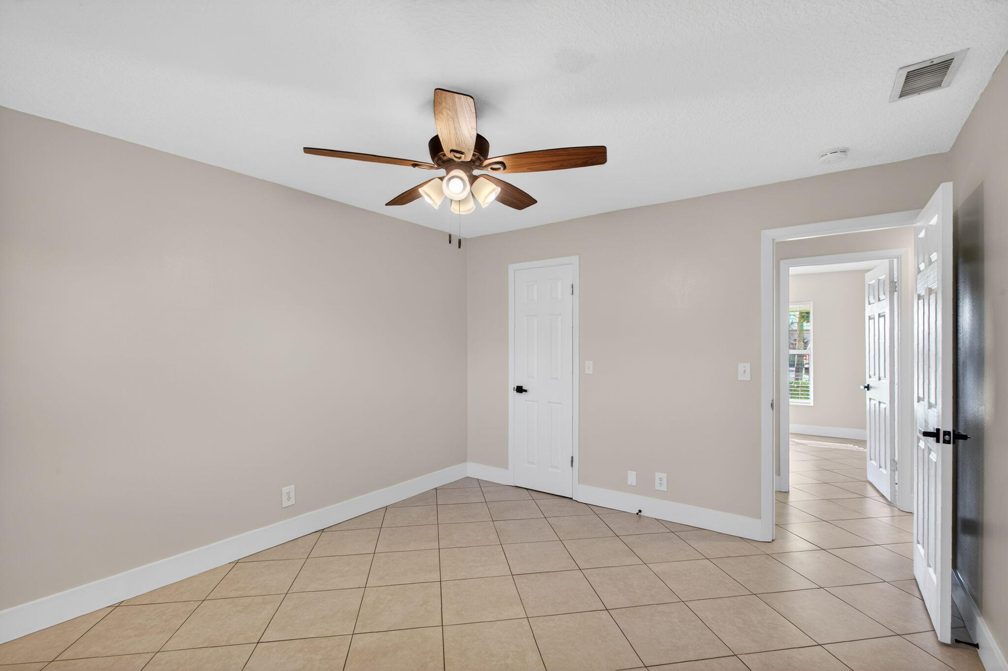 8695 Southeast Hobe Ridge Avenue Hobe Sound, FL 33455 - Photo 17 of 29 a view of an empty room