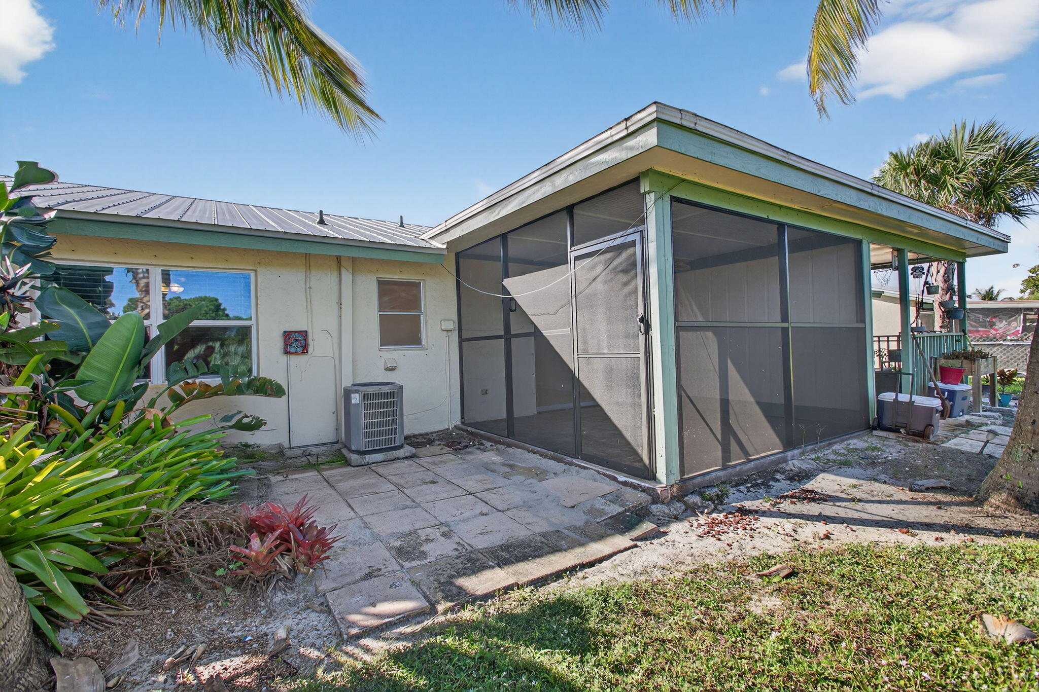 8695 Southeast Hobe Ridge Avenue Hobe Sound, FL 33455 - Photo 26 of 29 a view of a house with potted plants