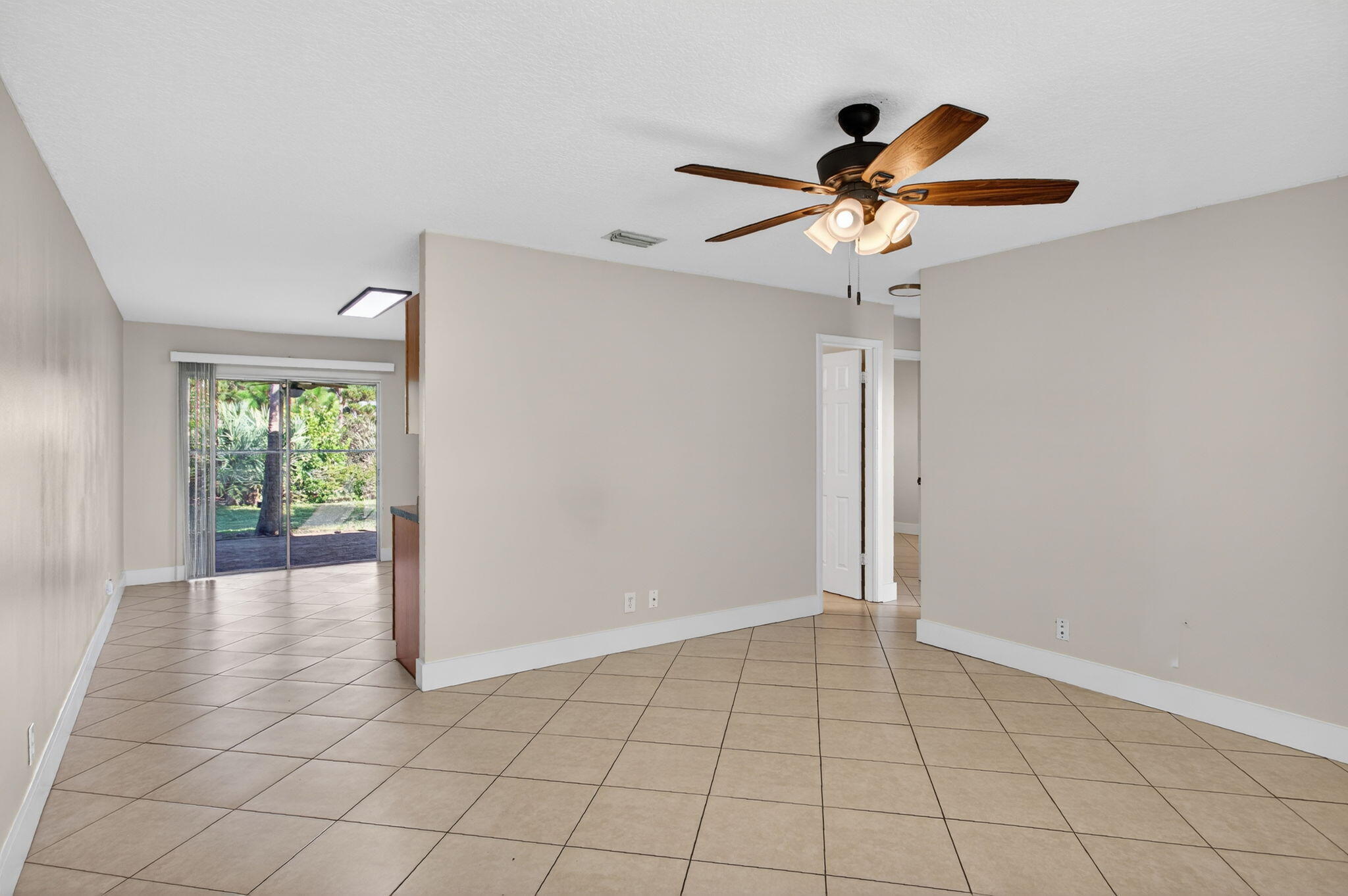 8695 Southeast Hobe Ridge Avenue Hobe Sound, FL 33455 - Photo 7 of 29 a view of an empty room with a window