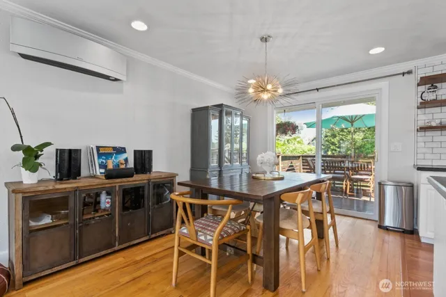 a view of a dining room with furniture window and wooden floor