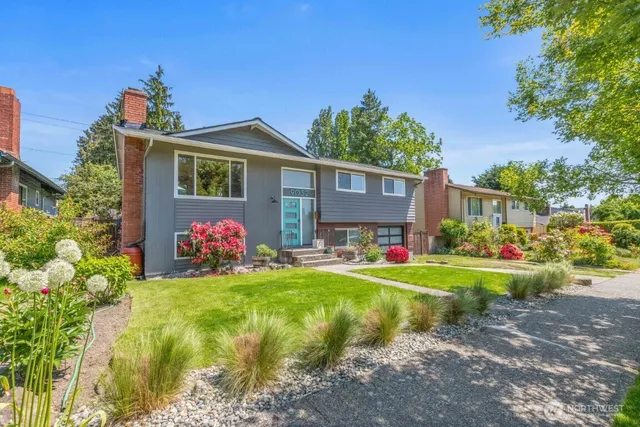 a front view of a house with swing and a yard