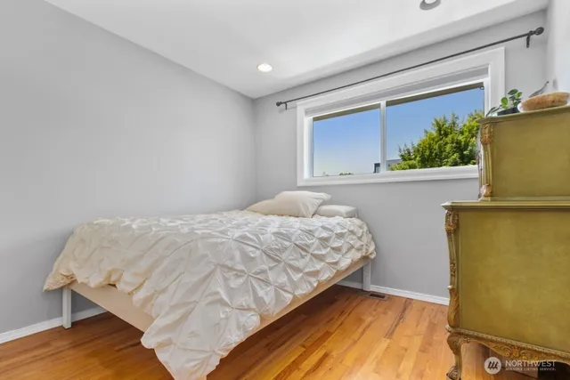 a bedroom with a bed and a desk