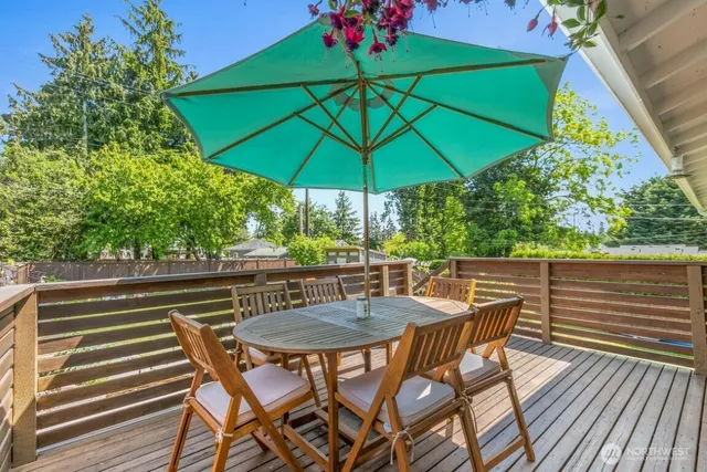 an outdoor space with furniture and umbrella