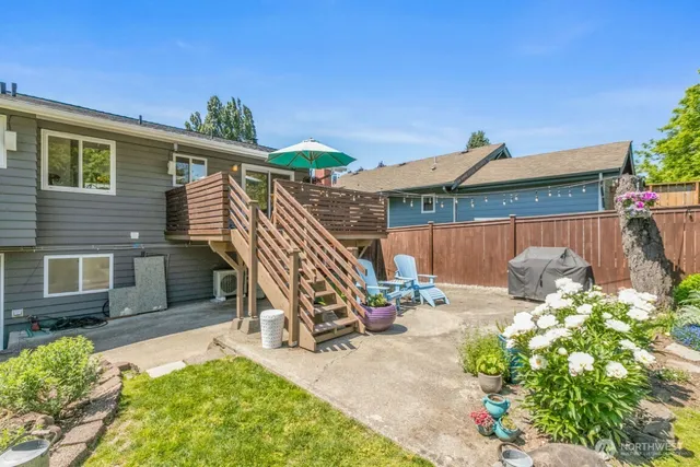 a view of a house with a yard and garden