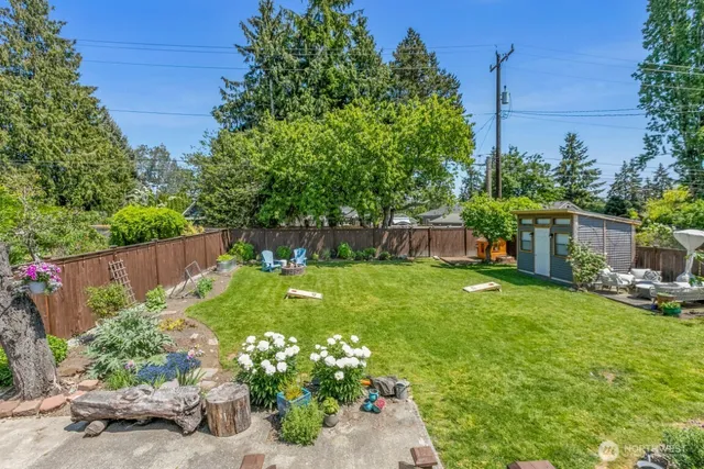 a view of a table and chairs in the garden