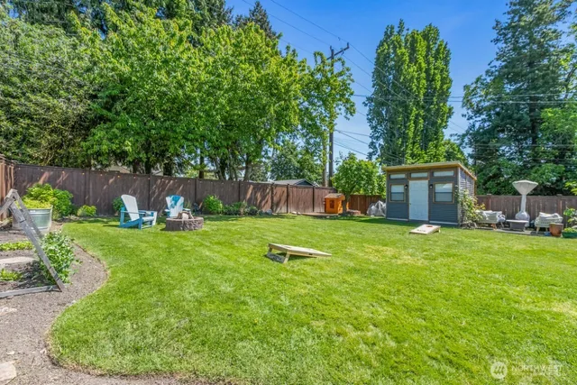 a backyard of a house with lots of green space