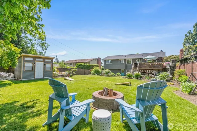 a view of backyard with furniture and garden