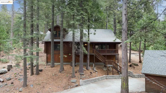 a kitchen with white cabinets and appliances