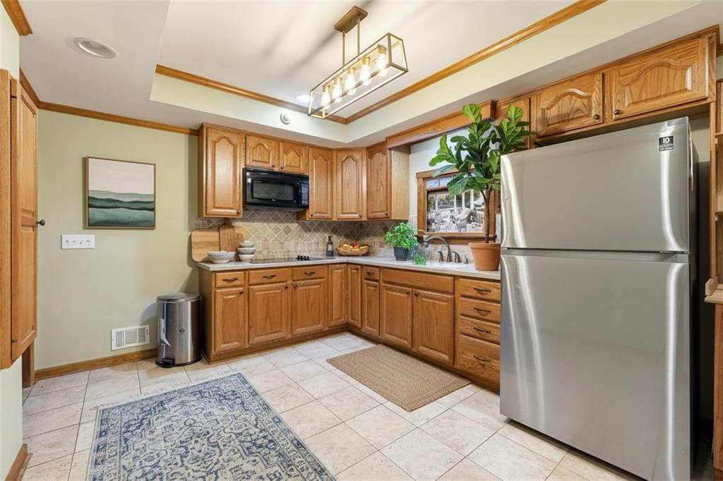 68 Old Mountain Road Northwest Powder Springs, GA 30127 - Photo 11 of 18 a kitchen with a refrigerator and a sink