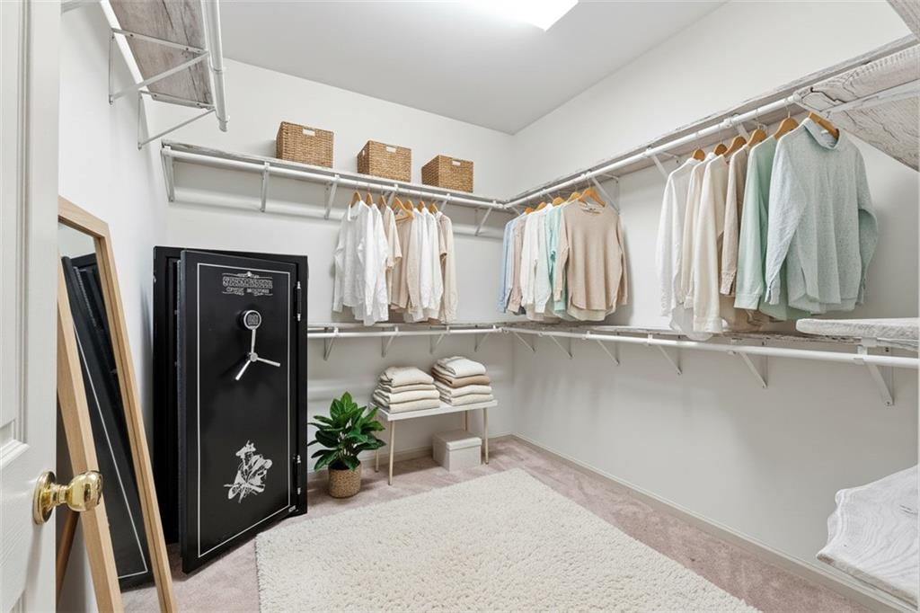 68 Old Mountain Road Northwest Powder Springs, GA 30127 - Photo 12 of 18 a view of walk in closet with clothes and shoes