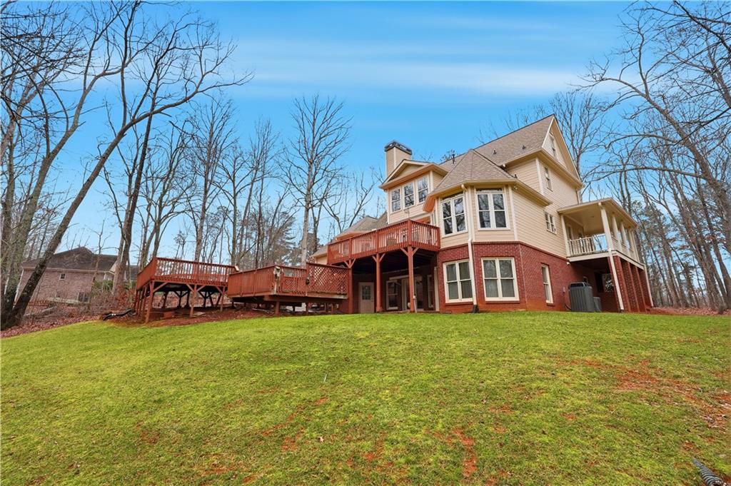 68 Old Mountain Road Northwest Powder Springs, GA 30127 - Photo 16 of 18 a view of a house with a yard and sitting area