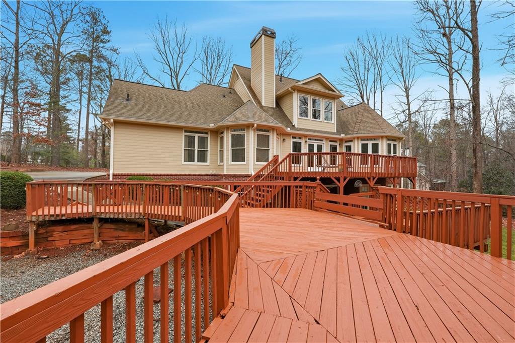 68 Old Mountain Road Northwest Powder Springs, GA 30127 - Photo 18 of 18 a view of a house with wooden deck
