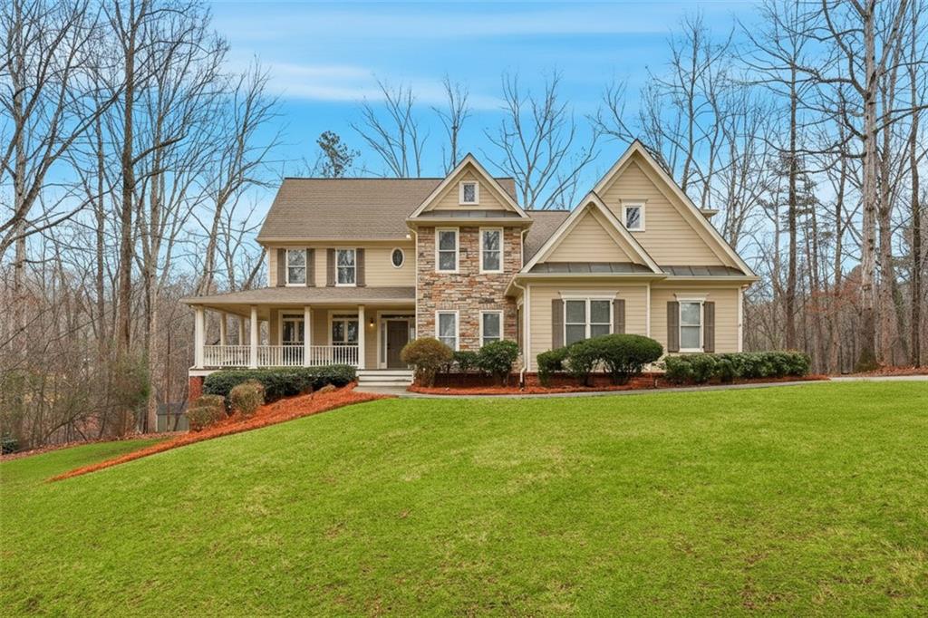 68 Old Mountain Road Northwest Powder Springs, GA 30127 - Photo 2 of 18 a front view of a house with a garden and trees