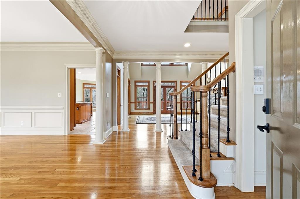 68 Old Mountain Road Northwest Powder Springs, GA 30127 - Photo 3 of 18 a view of a hallway with wooden floor and staircase