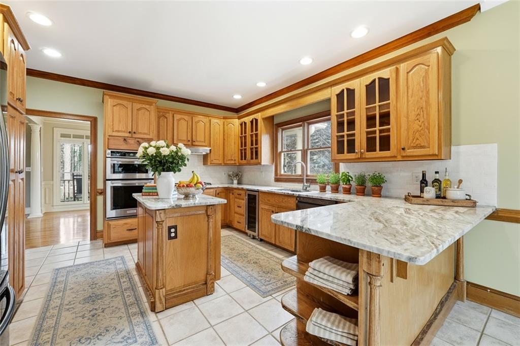 68 Old Mountain Road Northwest Powder Springs, GA 30127 - Photo 6 of 18 a kitchen with a stove a sink and a refrigerator