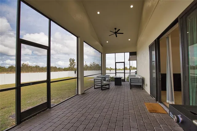 a lobby with furniture and floor to ceiling window