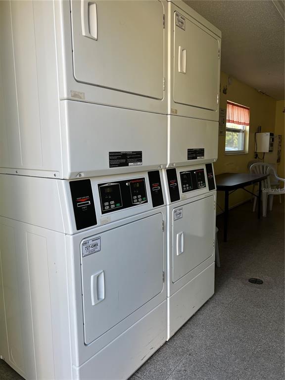 5521 Bay Boulevard, Unit 105 Port Richey, FL 34668 - Photo 14 of 15 a utility room with dryer and washer