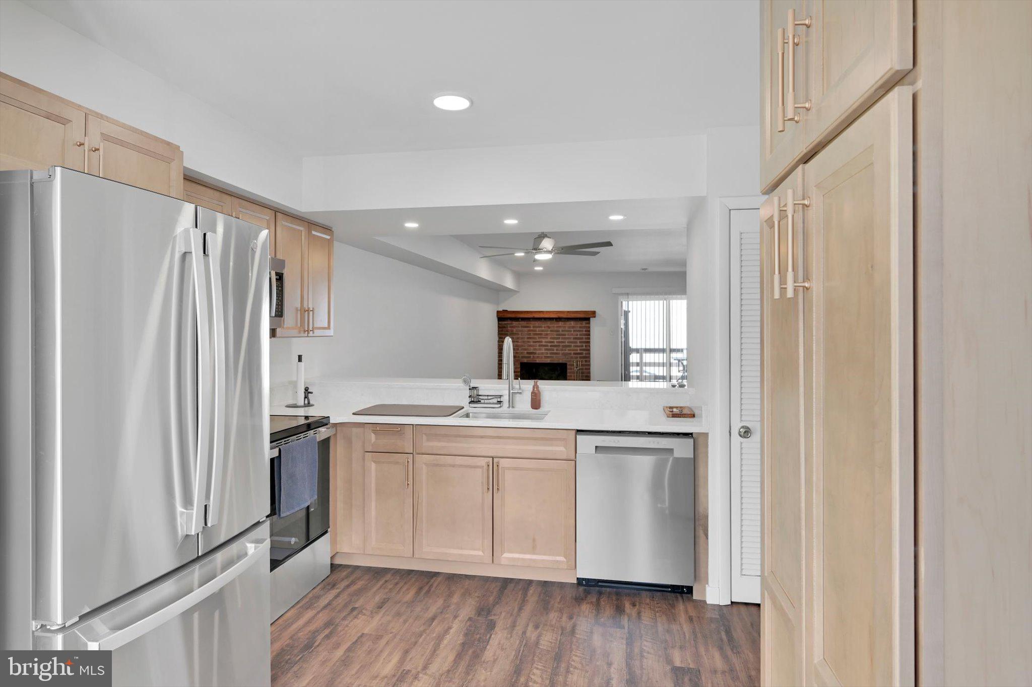2604 Village Road Orwigsburg, PA 17961 - Photo 9 of 24 a kitchen with a sink a refrigerator and cabinets